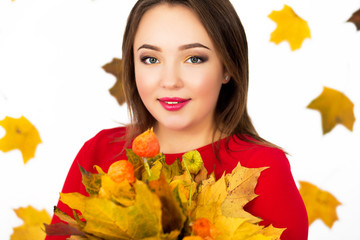 girl with a bouquet of leaves on a white background