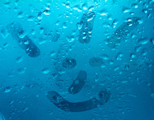 The smilie drawn on the sweaty glass