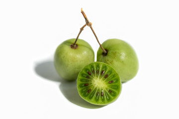 Isolate of Actinidia fruit of the far East on a white background.