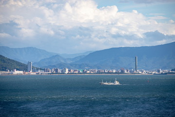 Seascape of the seto inland sea(a sailing ship and distant view of Utazu) ,Shikoku,Japan