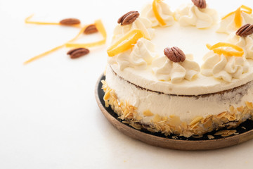 Vegan, raw carrot cake. Healthy food. White stone background. . Copy space.