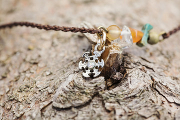 Tiny fashionable female bracelet on wooden background