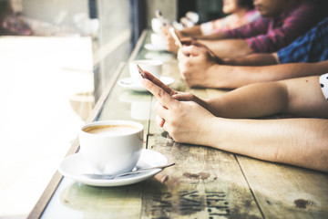 Young friends using smartphones and drinking coffee, Youth, new generation addiction and friendship concept, selevtive focus