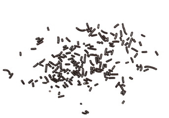 Decorative chocolate sprinkles, granules for cakes and pastries isolated on white background and texture, top view