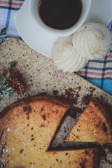 Breakfast. Coffee and pie with fruit filling on the table.