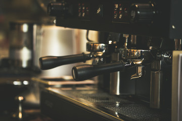 Close-Up of professional coffee machine making a cup of coffee. It's coffeemakers or coffee machines are cooking appliances used to coffee