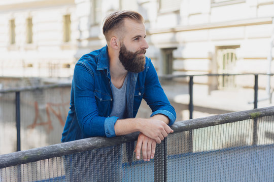 Romantic young man daydreaming about future