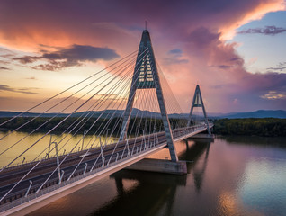 Fototapeta na wymiar Budapest, Hungary - Megyeri Bridge over River Danube at sunset with beautiful dramatic clouds and sky