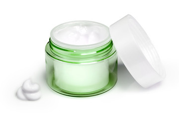 Container of moisturizing face cream on white background. Fashion woman still life. Pop female things, medicine and cosmetic theme.