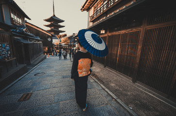Beautiful japanese senior woman walking in the village. Typical japanese traditional lifestyle