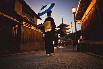 Beautiful japanese senior woman walking in the village. Typical japanese traditional lifestyle