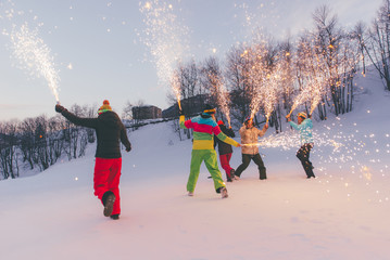 Friends playing on the mountains, celebrating and having fun