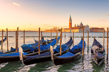 Fototapeta na wymiar Venice sunrise. Venice gondolas on San Marco square at sunrise, Grand Canal, Venice, Italy,