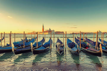 Sunrise view of traditional Gondolas on Canal Grande, San Marco, Venice, Italy.Vintage processed.