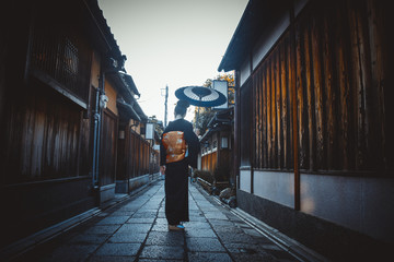 Beautiful japanese senior woman walking in the village. Typical japanese traditional lifestyle