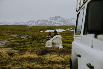 Couple making a wanderlust vacation, exploring iceland with their 4x4 jeep