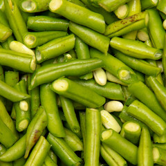 Harvest of green beans from the garden as a background