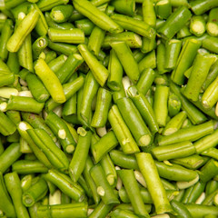 Harvest of green beans from the garden as a background