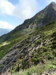 Fototapeta premium Waterfall Bear and peak Black pyramid. Caucasus, Russia