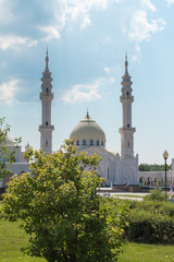 Fototapeta na wymiar White mosque on blue sky background.