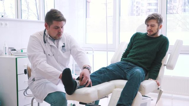 doctor traumatologist examines the patient.