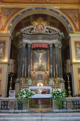 Fototapeta na wymiar View of main altar in the Basilica of San Lorenzo in Lucina in Rome