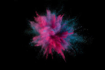 Colored powder explosion. Abstract closeup dust on backdrop. Colorful explode. Paint holi