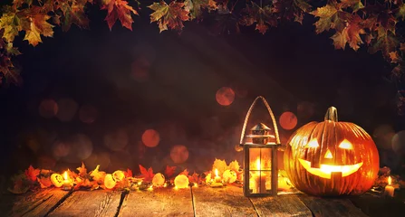 Gordijnen Halloween pumpkin with lantern on wooden © Alexander Raths