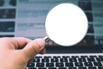 Magnifying Glass With Laptop Background