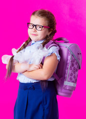   schoolgirl against pink background