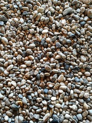 gravel on ground construction material for reference. ground and sub base layer of floor. river stone smooth curve edge stone.