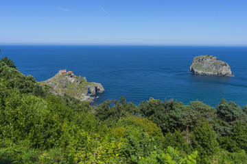 Summer sea, San Juan Gaztelugatxe island view, basque country, historical island with chapel in Northern Spain