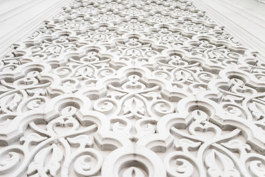 Arabian Muslim Islamic white oriental national pattern with relief elements. Textured white wall, mosque decor element.