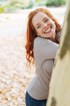 Attractive young redhead woman with a lovely smile