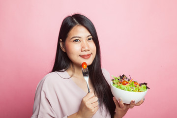 Healthy Asian woman with salad.