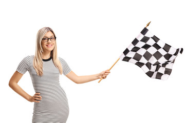 Young woman waving a checkered flag © Ljupco Smokovski