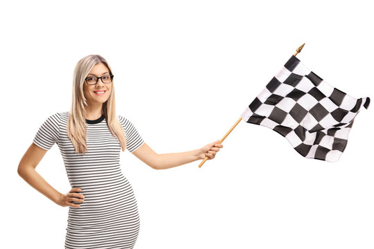 Young woman waving a checkered flag