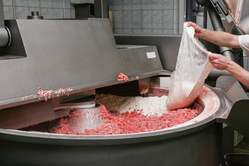 Mixing ingedients for sausages on a production line