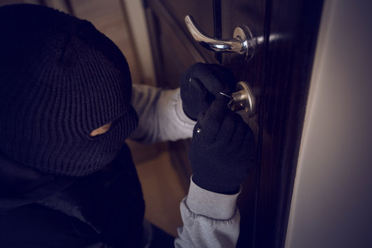 burglar breaking into the lock
