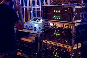 Dj mixing console and music audio amplifiers © Daniel Jędzura