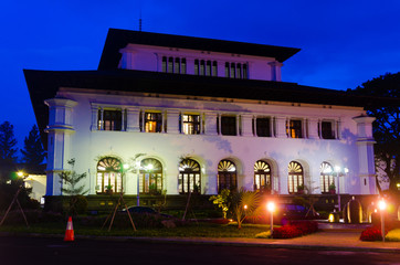 Old historical heritage european dutch style architecture building for government office under blue light sky and mosque for quiet peaceful worshipping