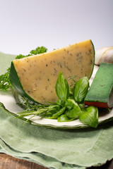 Dutch specialty hard cheese made from cows milk with different spices and fresh green herbs