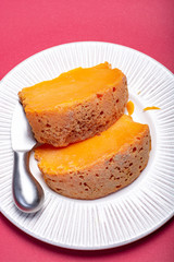 Two pieces of native French aged cheese Mimolette, produced in Lille with greyish curst made by special cheese mites