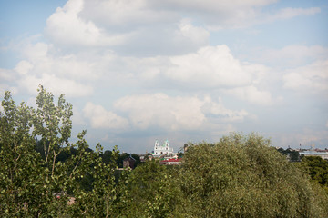 Sights and views of Grodno. Belarus. A view of St. Xavier's church through the leaves of the trees.