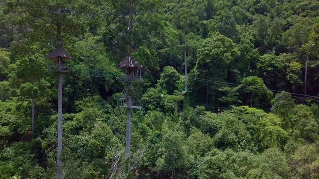 Aerial View of Tourists Riding on Zipline or Canopy Rope. Adrenaline Adventure on Vacation