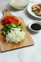 Preparing ingredients for arroz negro - black rice