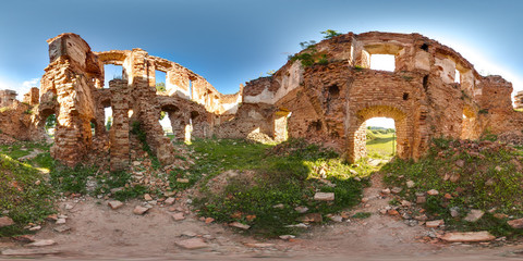 Ruins of ancient brick castle with blue sky sun green grass 3D spherical panorama with 360 degree viewing angle. Ready for virtual reality in vr. Full equirectangular projection. Beautiful background