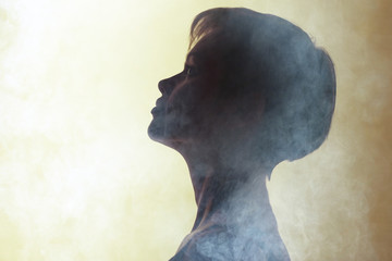 Silhouette of a girl with short hair studio portrait