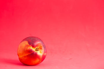 Nectarines on a colored background