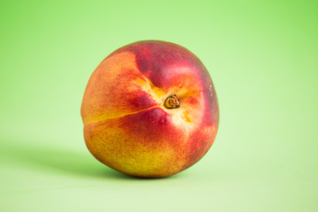 Nectarines on a colored background